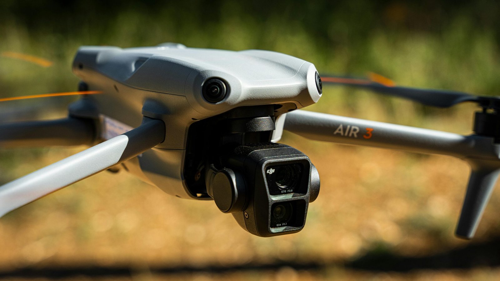 A detailed close-up of the DJI Air 3 drone camera in flight, showcasing its advanced design.
